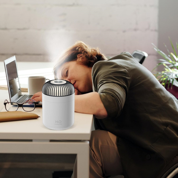 woman falling asleep on pc with Dreamzy Oil Diffuser