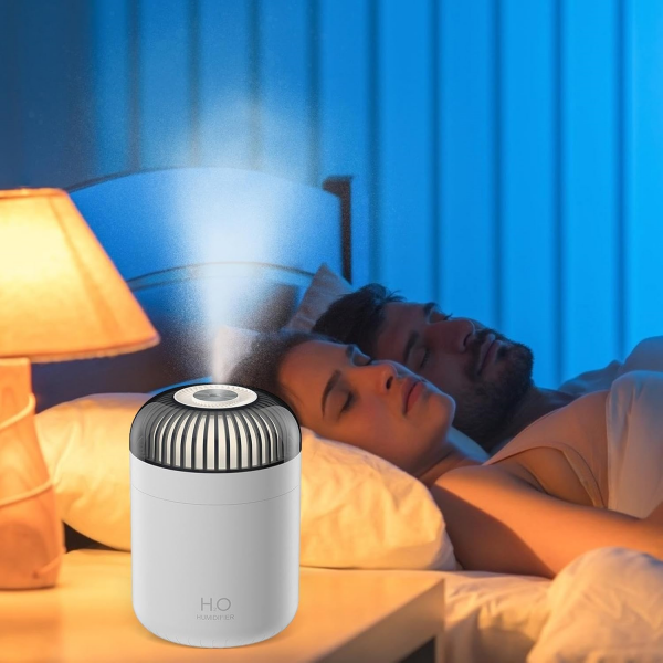 couple sleeping with Dreamzy Oil Diffuser on